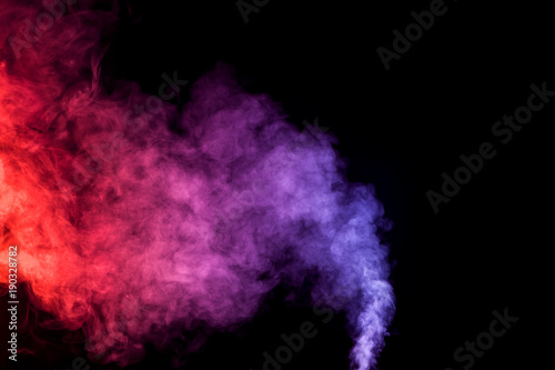 Cloud of smoke of purple, red and orange colors on black isolated background. Background from the smoke of vape