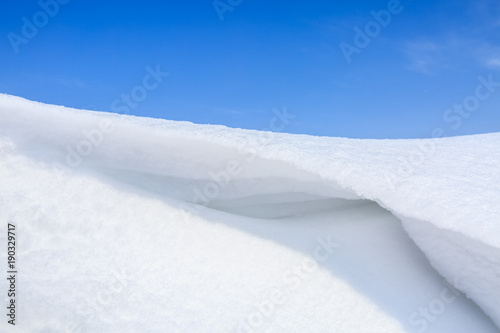 beautiful snow and blue sky natural background in winter