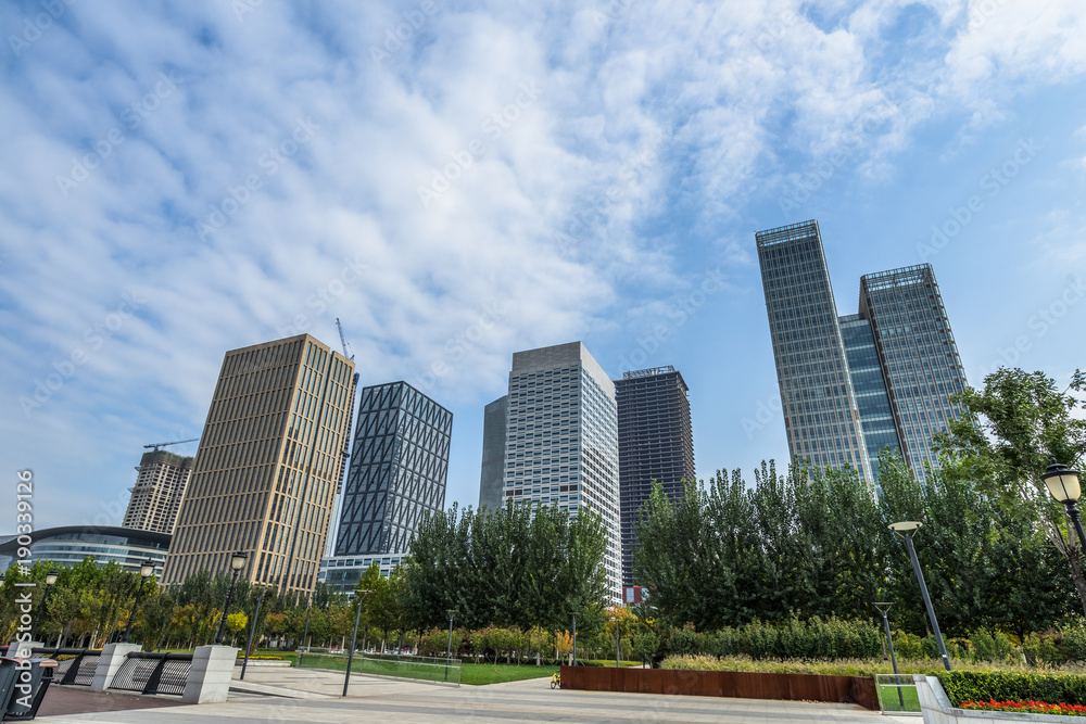 Perspective view of contemporary glass building skyscraper.