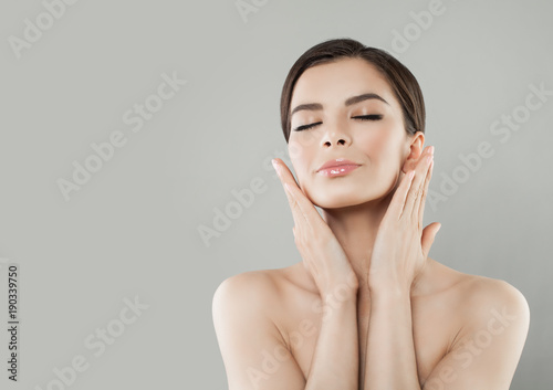 Spa Portrait of Beautiful Woman with Healthy Skin. Nice Model on Background photo