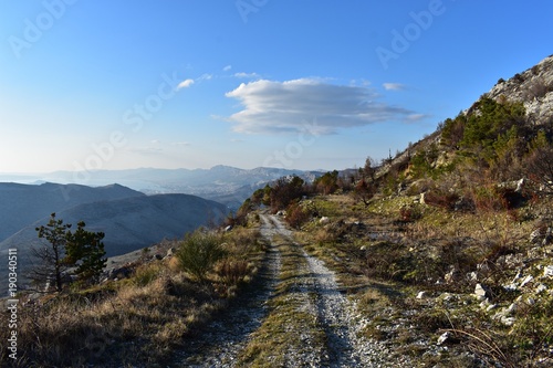 Narrow high path on dry rocky mountain. Beautiful scenery landscape.