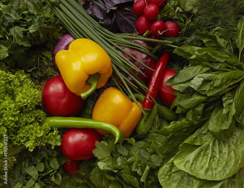 Different raw vegetables on craft paper background. Healthy nutrition.