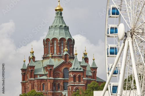 Helsinki skyline city center. Big wheel and Uspenki cathedral photo