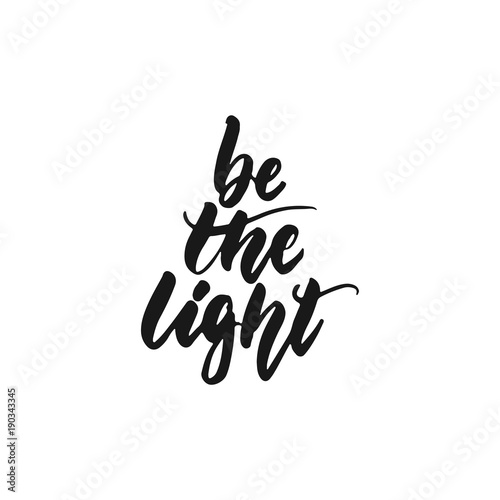 Be the light - hand drawn lettering phrase isolated on the white background. Fun brush ink inscription for photo overlays, greeting card or print, poster design.