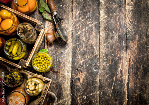 Various preserved vegetables and mushrooms with seamer and spices.