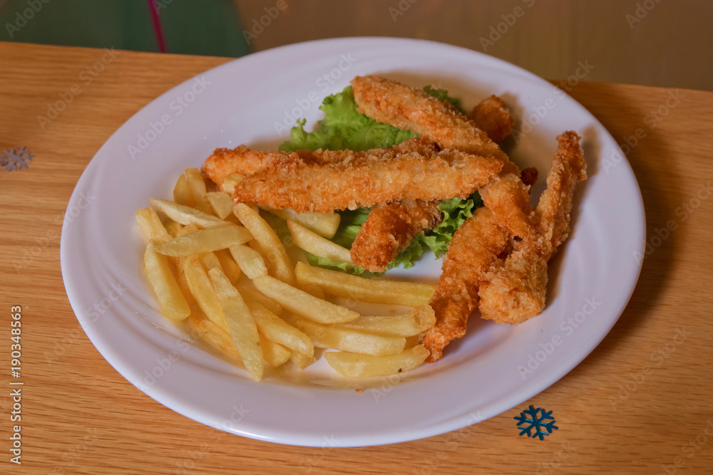 Chicken nectar with potato free . Chicken steak and potatoes on a wooden background. Top view. Free space for text. Chicken nectar with potato free . Chicken steak and potatoes on a wooden background. Top view. Free space for text.