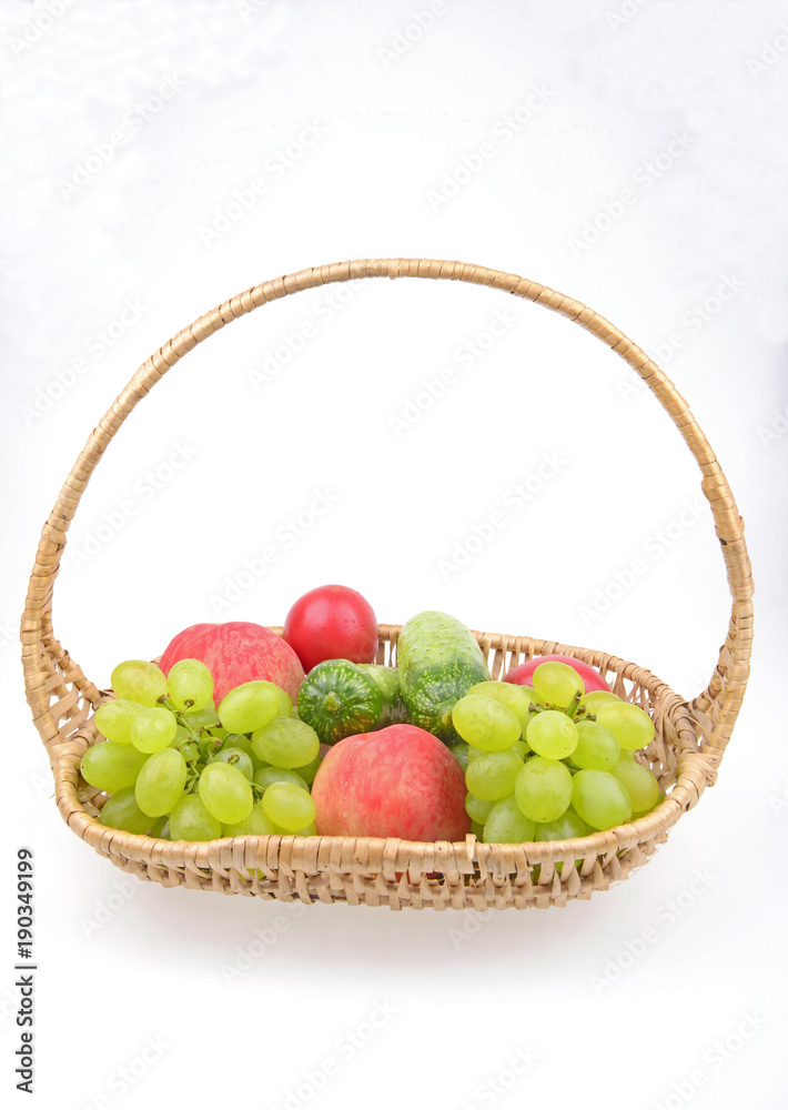 Fruit in the basket isolated on a white background Fruit in the basket isolated on a white background
