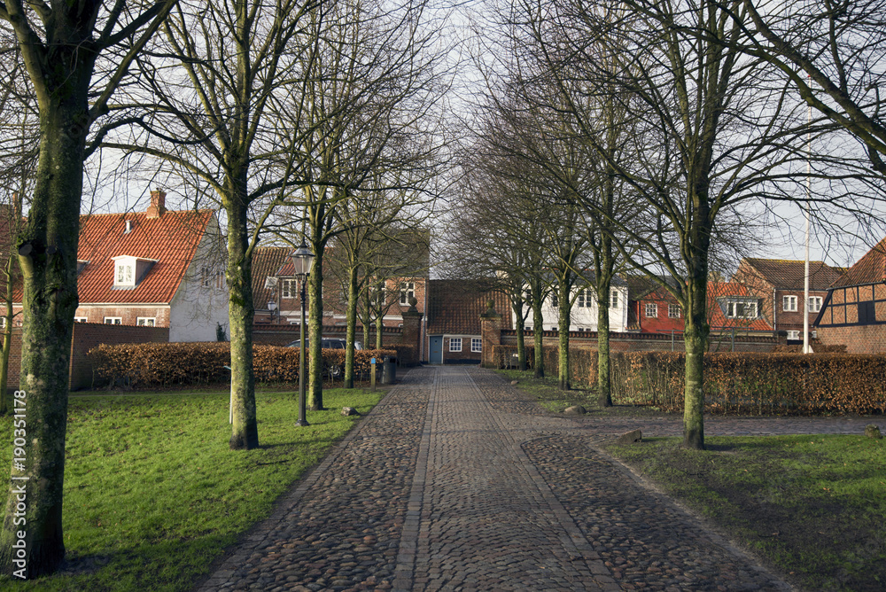 Cobblestone avenue with old houses Cobblestone avenue with old houses