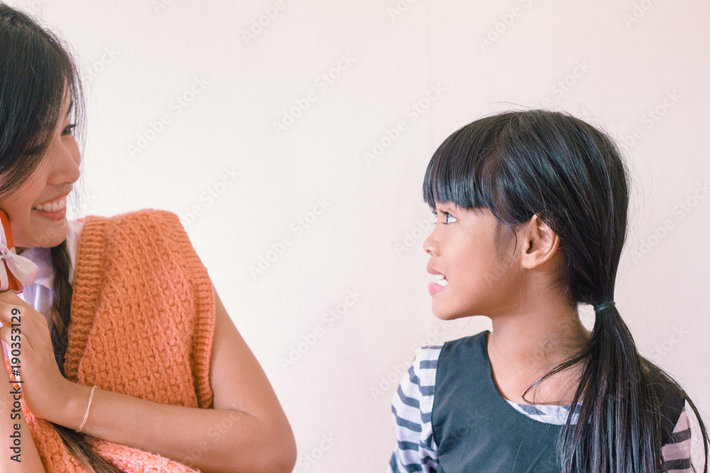 Sisterhood Concept - Two young asian girls smile Sisterhood Concept - Two young asian girls smile