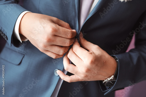 Man arranging his buttonholes
