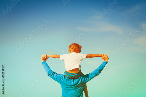 happy father and son having fun on sky © nadezhda1906