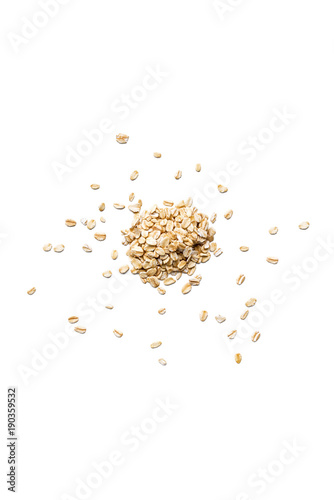 Organic oat flakes isolated on white background. Vertical composition. Top view