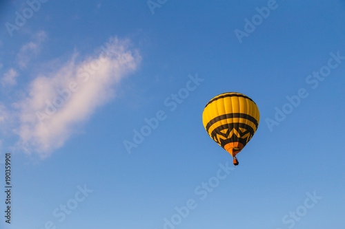Hot air balloon in blue sky photo