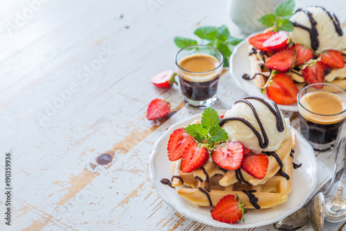 Waffles with strawberry  ice cream and chocolate