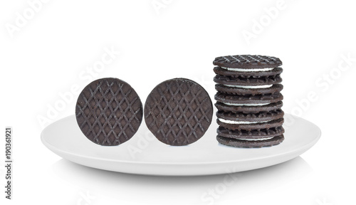 sandwich cookies with cream in white plate on white background