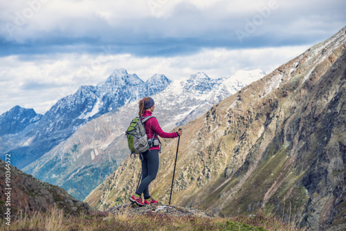 Young woman on the top of mountains