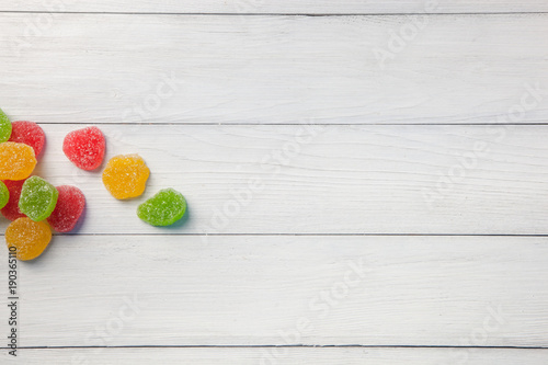 Marmalade green, yellow and red on a light wooden background