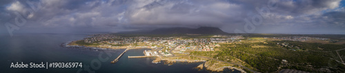 Fototapeta Naklejka Na Ścianę i Meble -  Panoramic view over the small fishing and tourist town of Gansbaai in the Overberg in South Africa, renowned for its great white shark diving