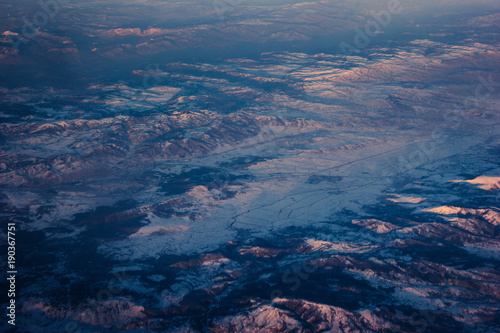 Beautiful Landscape of Mountains. View from the airplane window