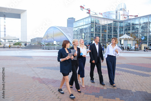 Obraz na plátně Successful business partners changing ideas about new project in La Defense Paris