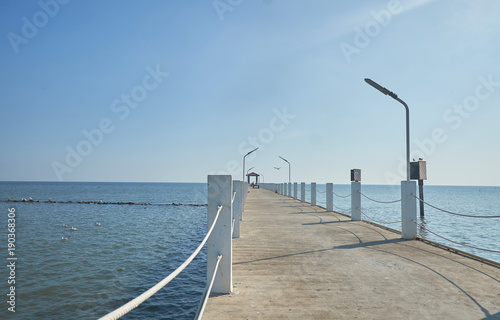 The bridge that juts out into the sea There sit blue sky is beautiful.