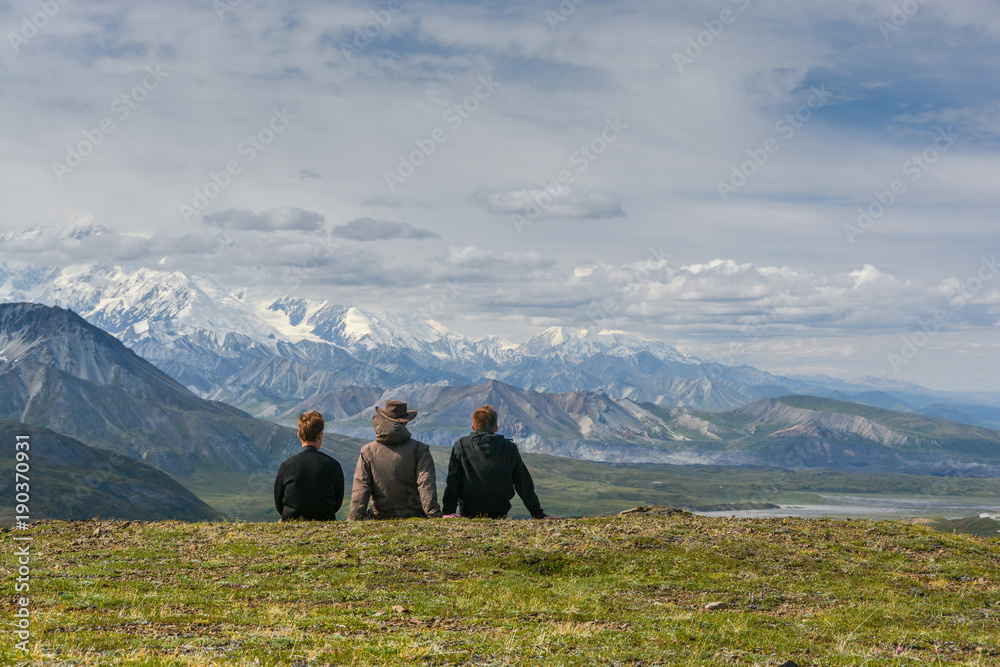 three personen enjoying the view in Denali National Park, Alaska