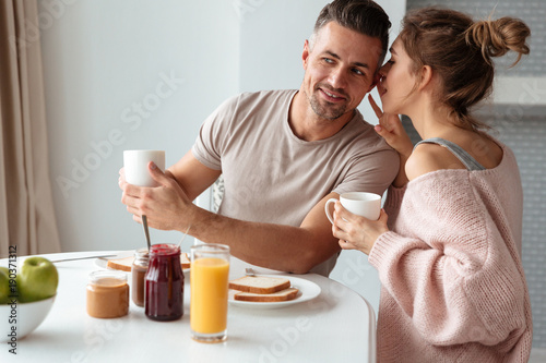 Portrait of a young loving couple having breakfast