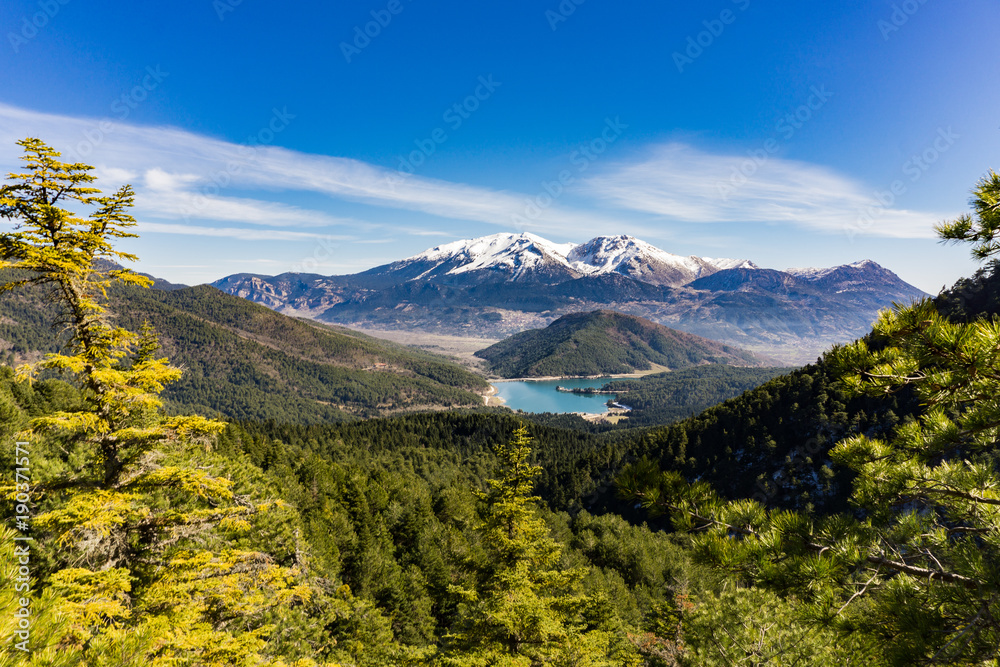 Panoramic view of Doxa lake and the snow covered Ziria mountain in Peloponnese Greece