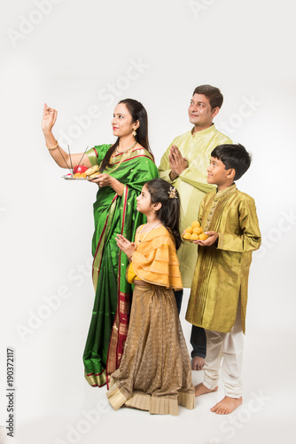 Indian family celebrating Gudi Padwa or Ugadi festival, which is a new year in Hindu tradition
 photo