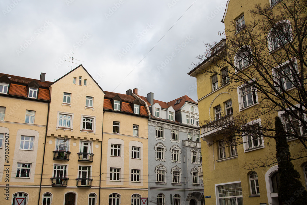 Row of houses with old building houses in Schwabing, colorful facade