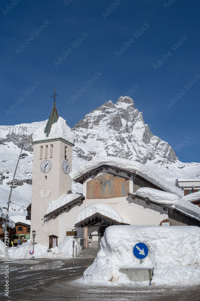 Breuil-Cervinia, Aosta Valley, Italy. Bell tower with Mount Cervino in background