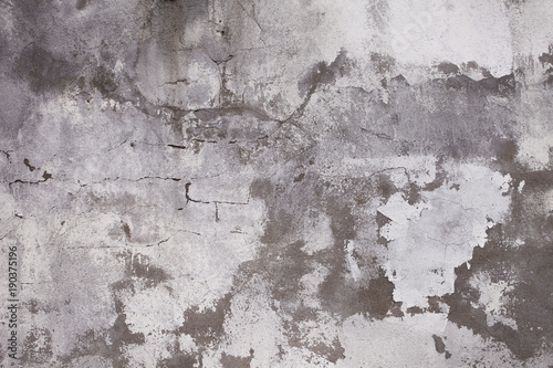 Old concrete wall with cracks. Aged cracked plaster wall background and textu...