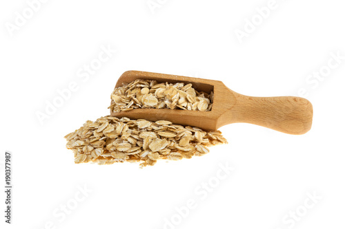 oatmeal on a wooden spoon isolated on a white background