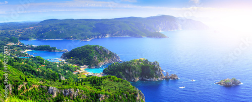 Beautiful summer panoramic seascape. View of the coastline into the sea bay with crystal clear azure water. Paleokastrica. Corfu. Ionian archipelago. Greece.