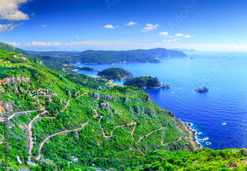 Beautiful summer panoramic seascape. View of the coastline into the sea bay with crystal clear azure water. Paleokastrica. Corfu. Ionian archipelago. Greece. photo