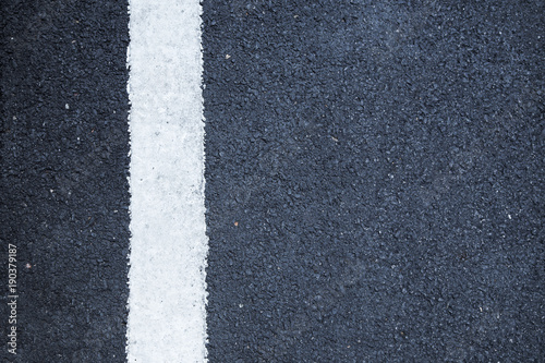 single white lines asphalt road background © PRASERT