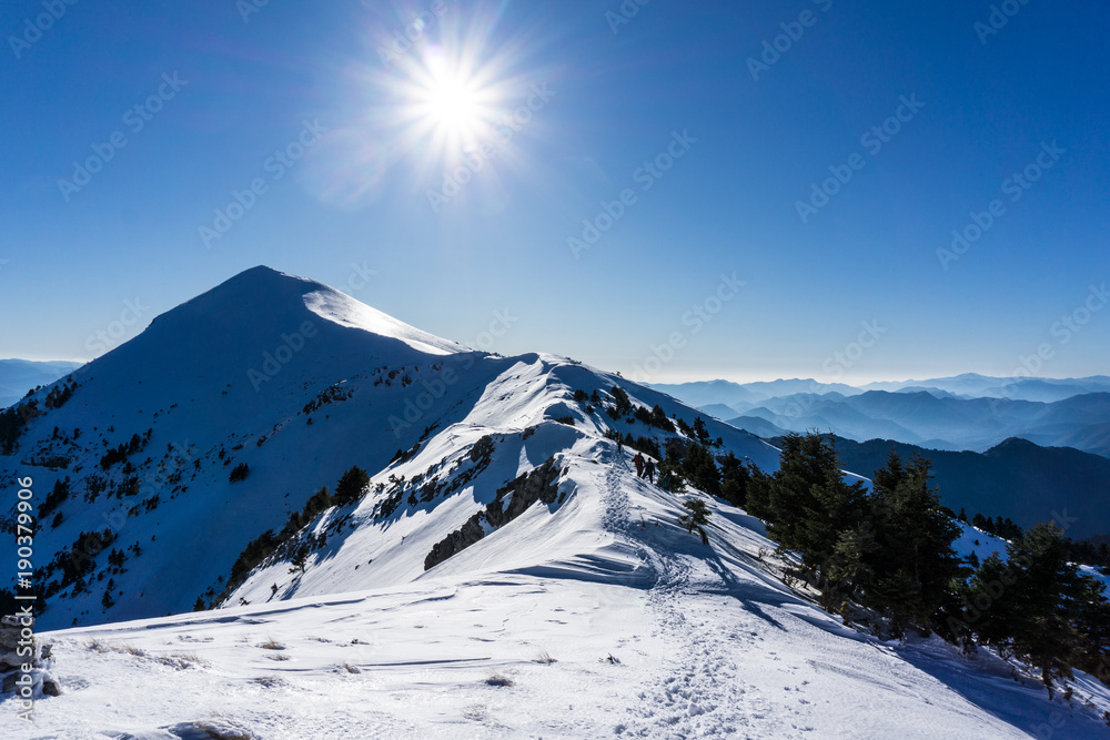 Summit of Dourdouvana snow covered mountain in Peloponnese Greece