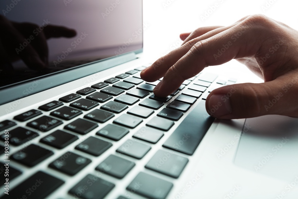 Closeup of a Man Typing on a Laptop Closeup of a Man Typing on a Laptop