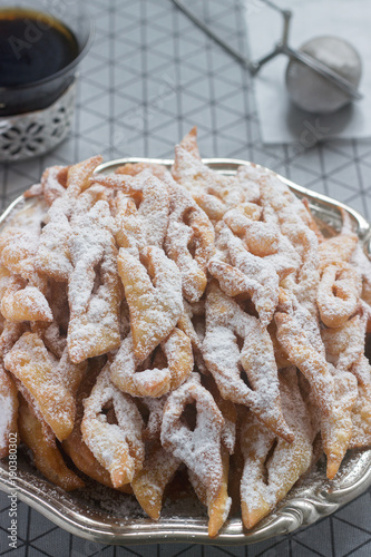 Angel wings biscuits, a traditional European sweet dish for carnival. Rustic style. photo