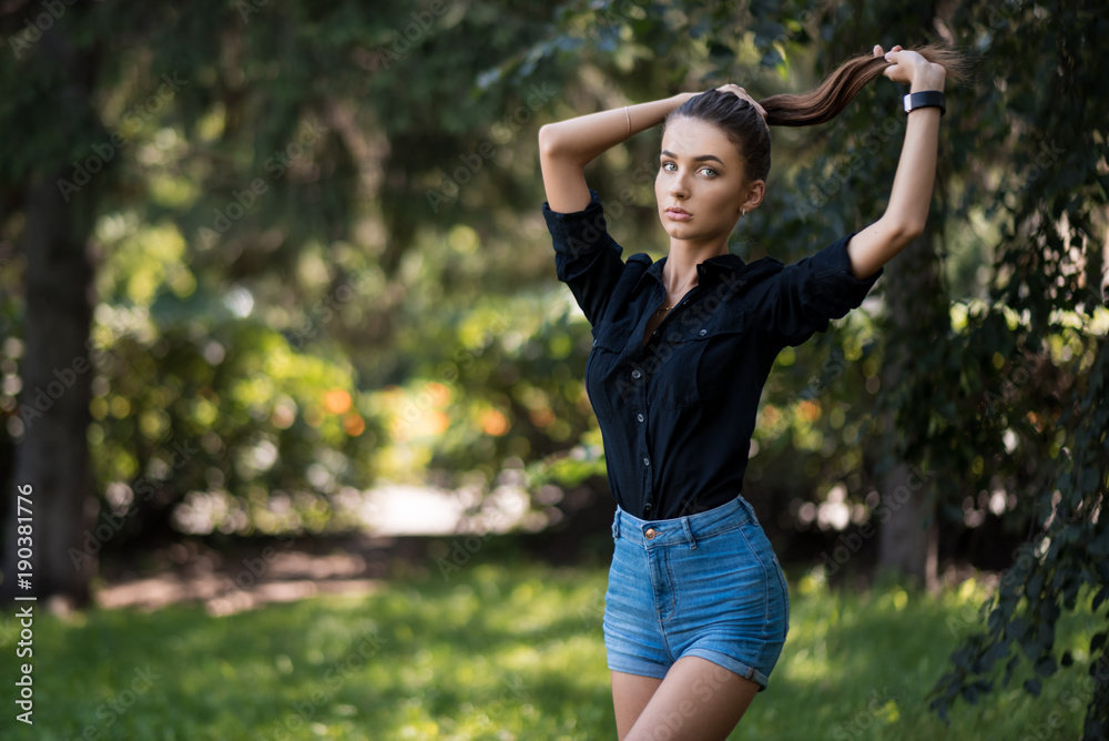 Beautiful fashion girl holding her hair in the tail. Beautiful fashion girl holding her hair in the tail.