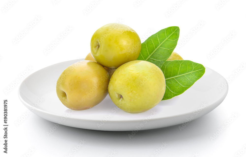 green olives in a plate isolated on a white background