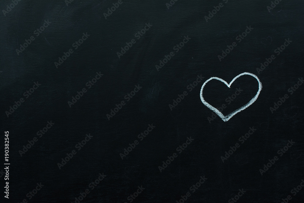 Love heart symbol on a blackboard: Creative Love or Valentine's Day Concept