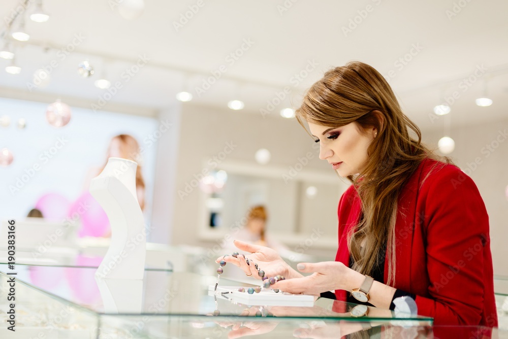 Young beauty elegance woman buying necklace