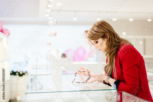 Young beauty elegance woman buying necklace