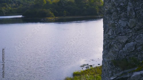 Ancient Castle on a lake in Scotland at Sunset