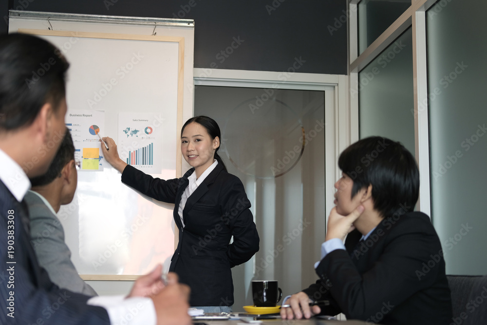 businesswoman present financial plan report to co worker team. woman leader discuss sales data with investor colleagues. finance investment business meeting businesswoman present financial plan report to co worker team. woman leader discuss sales data with investor colleagues. finance investment business meeting