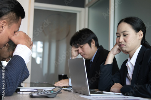bored businesswoman lean head on hand at meeting. unhappy businessman at conference. sad colleagues at office. teamwork crisis © 88studio