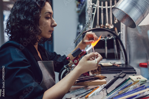 Glass blower makes the costume jewelery from the Venetian glass.