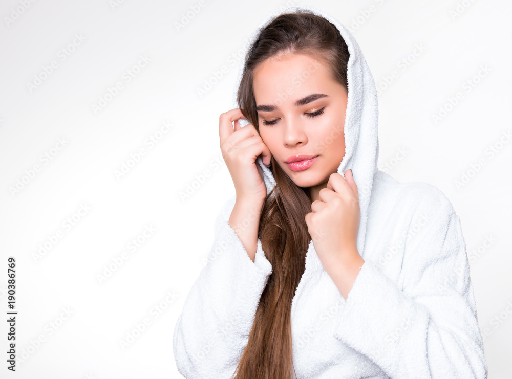 beautiful young woman with long hair wearing a bath robe beautiful young woman with long hair wearing a bath robe
