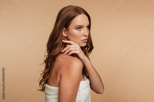 Beauty portrait of mystery ginger woman with long hair